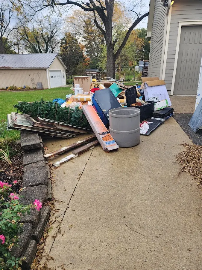 Dumpster being loaded with debris for 30 Yard Dumpster Rental in Richmond Heights